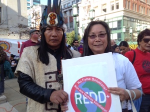 Mr. Ushigua, a Sapara leader from the Ecuadorian Amazon,  and Pam Tau Lee, a veteran Environmental Justice activist, protest REDD at  the SF Climate Justice March, Nov. 21, 2015